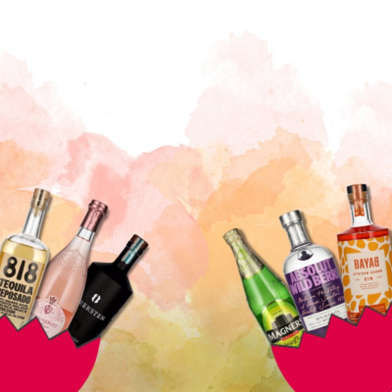 Against an illustrative background of white and various shades of orange, seven bottles of schnapps are arranged in the lower half of the frame, each containing different liqueurs. From left to right, the bottles are presented in
