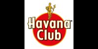 Logo met gouden figuur die staf vasthoudt, boven rode cirkel met opschrift "Havana Club".